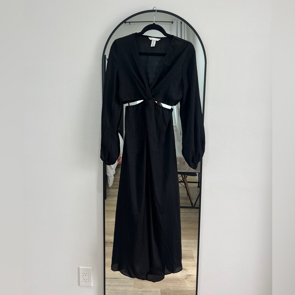 Black long sleeve dress with upper waist cutout.